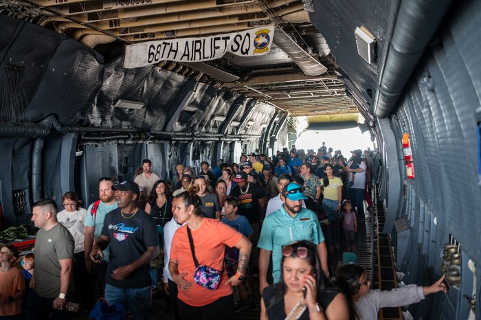 The Great Texas Airshow attendees walk through the fuselage of the 433rd Airlift Wing’s C-5M Super Galaxy near the entrance of the airshow at Joint Base San Antonio-Randolph, Texas Apr. 7, 2024.