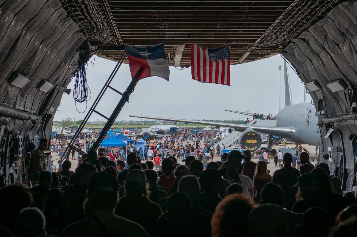 The Great Texas Airshow attendees walk out of the 433rd Airlift Wing’s C-5M Super Galaxy near the entrance of the airshow at Joint Base San Antonio-Randolph, Texas Apr. 7, 2024.