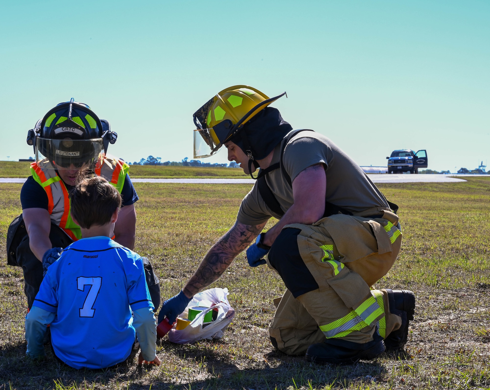 Members of the Combat Readiness Training Center Fire Department, Harrison County Fire Department and Gulfport Fire Department render aid to simulated victims during a disaster exercise at Gulfport-Biloxi International Airport, Gulfport, Mississippi, March 28, 2024.