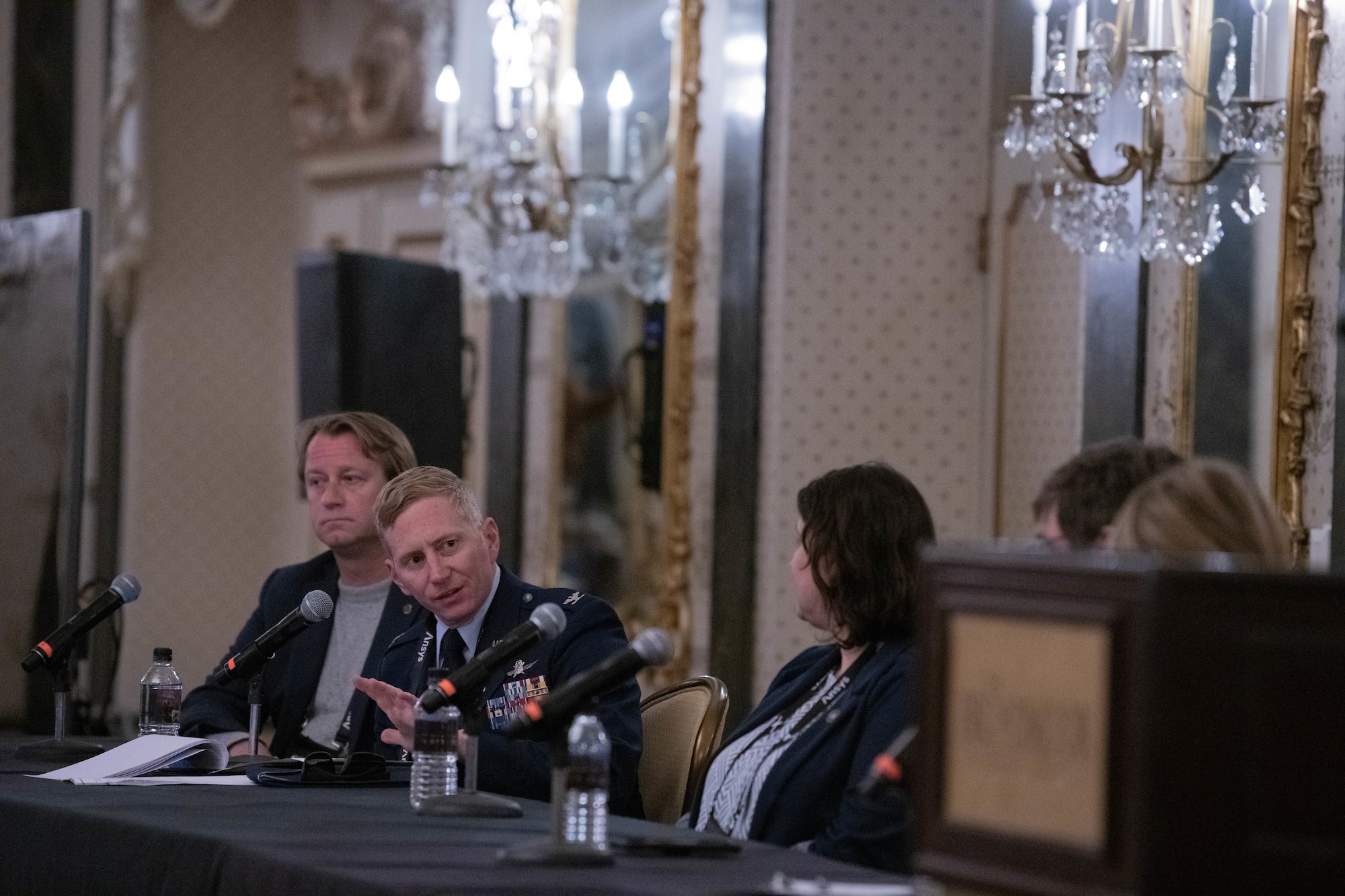U.S. Space Force Col. Christopher A. Kennedy, Space Delta 6 - Space Access and Cyberspace Operations commander, engaging with fellow panel members.
