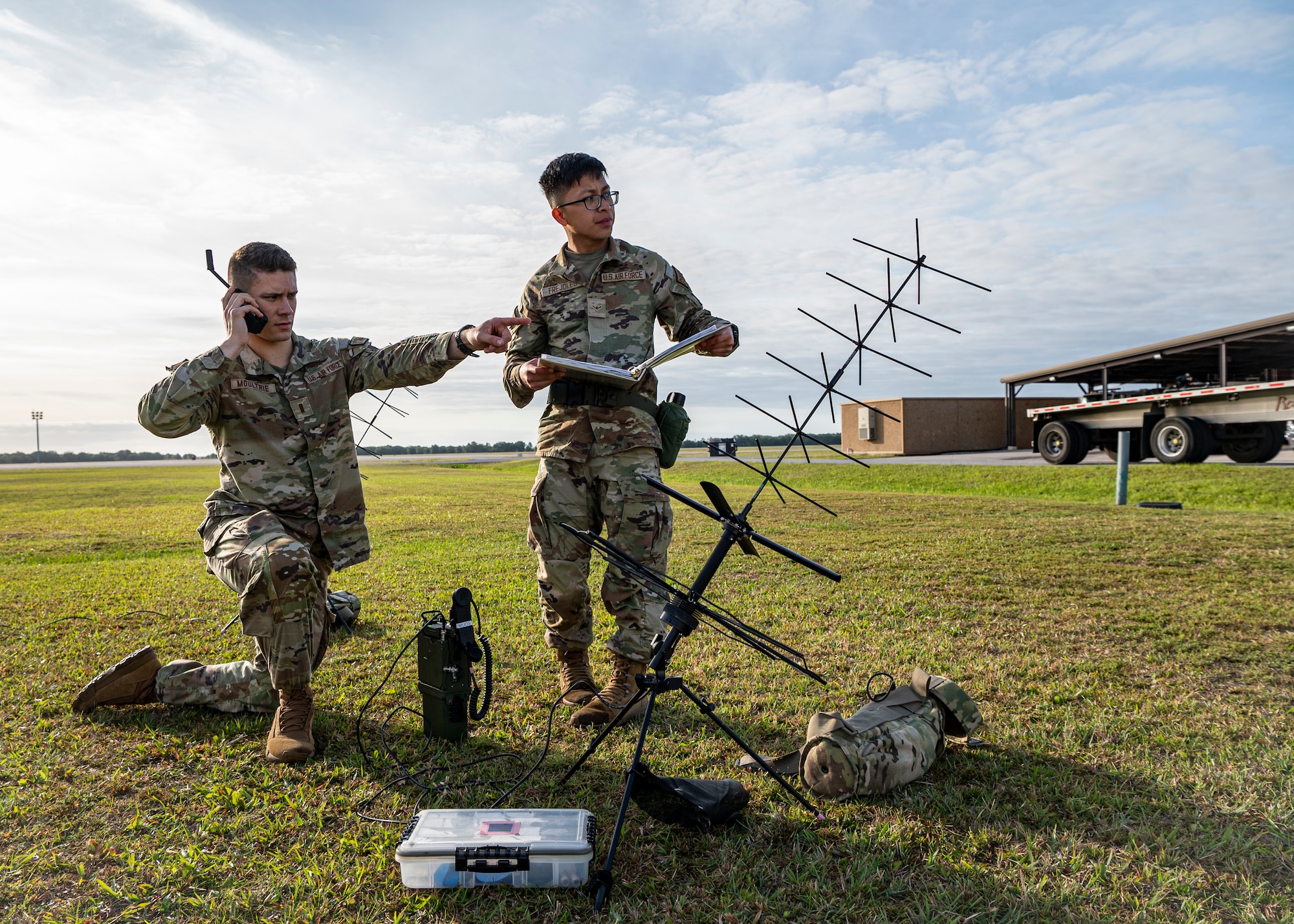 U.S. Air Force 2nd Lt. Jake Moultrie, 23rd Communications Squadron radio officer in charge, and Airman Randy Frejoles, 23rd CS radio frequency operator, test equipment at Avon Park Air Force Range, Florida, April 9, 2024. Rapid setup of communications capabilities is essential at austere locations when exercising the Agile Combat Employment concept.  Ready Tiger 24-1 is a readiness exercise demonstrating the 23rd Wing’s ability to plan, prepare and execute operations and maintenance to project air power in contested and dispersed locations, defending the United States’ interests and allies. (U.S. Air Force photo by Airman 1st Class Leonid Soubbotine)