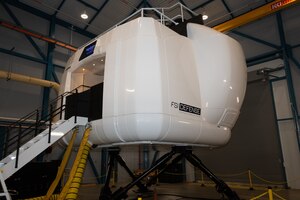 A view of the outside of the KC-46 weapons system trainer.