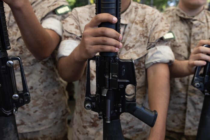 U.S. Marine Corps recruits with Echo Company, 2nd Recruit Training Battalion, hold their rifles during a M16A4 service rifle issue at Marine Corps Recruit Depot San Diego, California, April 8, 2024. Recruits were issued their rifles and briefed on responsibilities regarding rifle security, safety and proper handling. (U.S. Marine Corps photo by Cpl. Alexander O. Devereux)
