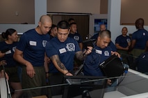 U.S. Marine Corps drill Instructors with India Company, 3rd Recruit Training Battalion, assemble monitors during a volunteer event at a Ronald McDonald House in San Diego, California, April 8, 2024. The Ronald McDonald House provides a home away from home at no cost for families with sick and injured children, ages 21 and younger. (U.S. Marine Corps photo by Lance Cpl. Janell B. Alvarez)