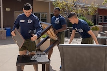 U.S. Marine Corps Sgt. Humberto Partida, left, Sgt Montell Scales, center, Sgt. Nicolas Gorena, right, all drill instructors with India Company, 3rd Recruit Training Battalion, assemble furniture during a volunteer event at a Ronald McDonald House in San Diego, California, April 8, 2024. The Ronald McDonald House provides a home away from home at no cost for families with sick and injured children, ages 21 and younger. (U.S. Marine Corps photo by Lance Cpl. Janell B. Alvarez)