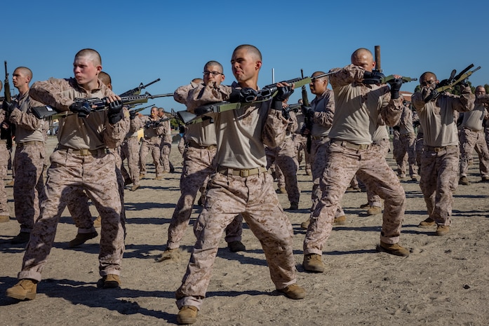 U.S. Marine Corps recruits with Bravo Company, 1st Recruit Training Battalion, practice bayonet techniques prior to the bayonet assault course at Marine Corps Recruit Depot, San Diego, California, April 10, 2024. Bayonet techniques tie into the Marine Corps Martial Arts Program that aims to strengthen the mental and moral resiliency of individual recruits and Marines through realistic combative training, warrior ethos studies, and physical hardening. (U.S. Marine Corps photo by Lance Cpl. Jacob B. Hutchinson)