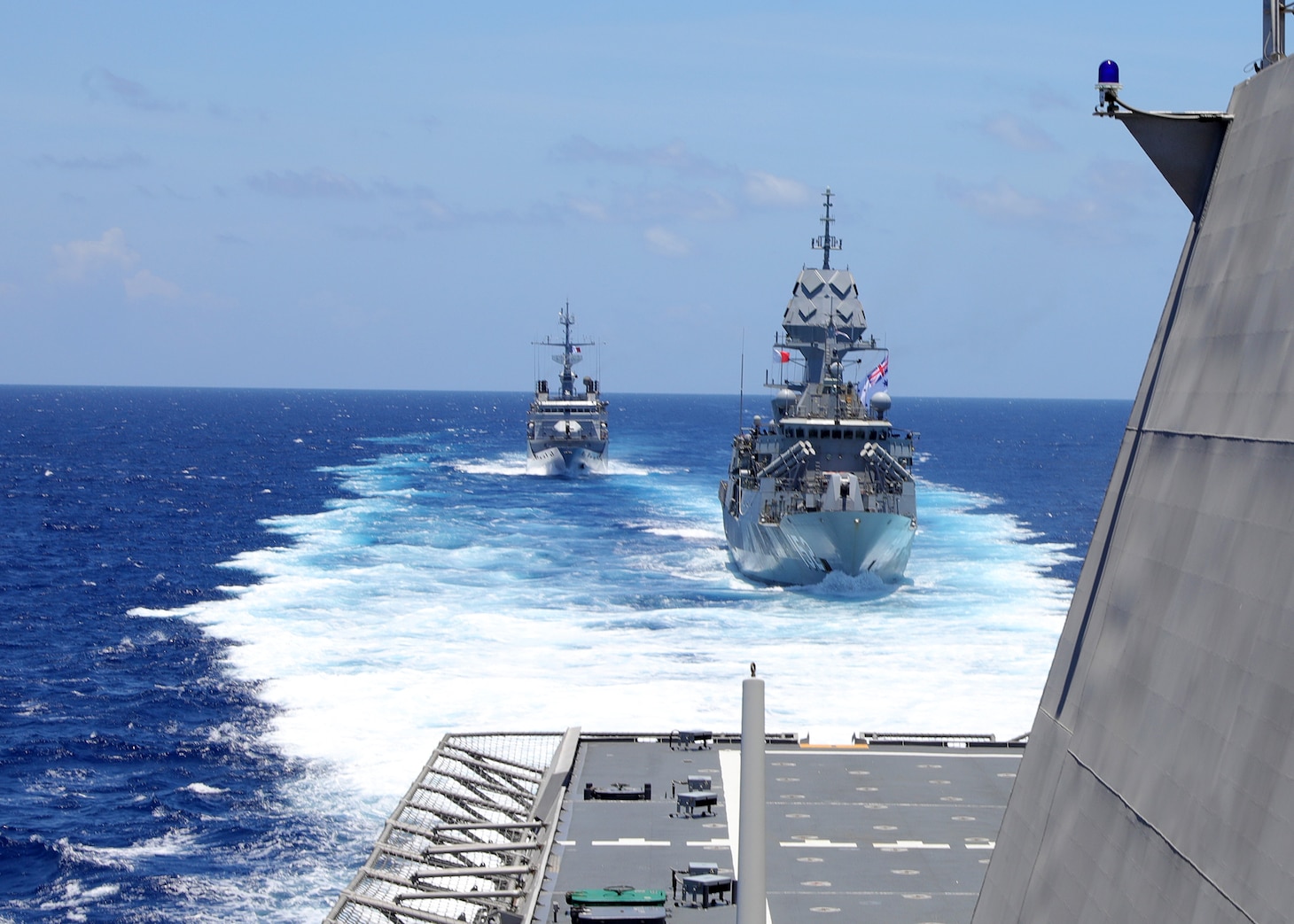 Royal Australian Navy frigate HMAS Warramunga (FFG 152), front, and French Navy Floréal-class frigate FS Vendémiaire (F 734), back, trail behind Independence-variant littoral combat ship USS Mobile (LCS 26), during trilateral operations in the South China Sea. Mobile, part of Destroyer Squadron 7, is on a rotational deployment operating in the U.S. 7th Fleet area of operations to enhance interoperability with allies and partners and serve as a ready-response force in support of a free and open Indo-Pacific region. (U.S. Navy photo by Mass Communication Specialist 1st Class Liz Dunagan/ RELEASED)