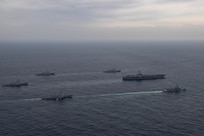 Ships assigned to the Theodore Roosevelt Carrier Strike Group, Japan Maritime Self-Defense Force and Republic of Korea Navy sail in formation during a trilateral exercise, April 11, 2024. This trilateral exercise allowed maritime forces from Japan, the Republic of Korea, and U.S. to train together to enhance coordination on maritime domain awareness and other shared security interests. The Theodore Roosevelt Carrier Strike Group is deployed to the U.S. 7th Fleet area of operations in support of a free and open Indo-Pacific. (U.S. Navy photo by Mass Communication Specialist 1st Class Tommy Gooley)