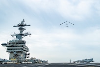 Aircraft assigned to Carrier Air Wing (CVW) 11 fly in formation over the Nimitz-class aircraft carrier USS Theodore Roosevelt (CVN 71) during a trilateral exercise, April 11, 2024. This trilateral exercise allowed maritime forces from Japan, the Republic of Korea, and U.S. to train together to enhance coordination on maritime domain awareness and other shared security interests. The Theodore Roosevelt Carrier Strike Group is deployed to the U.S. 7th Fleet area of operations in support of a free and open Indo-Pacific. (U.S. Navy photo by Mass Communication Specialist Seaman Apprentice Aaron Haro Gonzalez)
