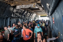 The Great Texas Airshow attendees walk through the fuselage of the 433rd Airlift Wing’s C-5M Super Galaxy near the entrance of the airshow at Joint Base San Antonio-Randolph, Texas Apr. 7, 2024.