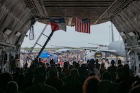 The Great Texas Airshow attendees walk out of the 433rd Airlift Wing’s C-5M Super Galaxy near the entrance of the airshow at Joint Base San Antonio-Randolph, Texas Apr. 7, 2024.