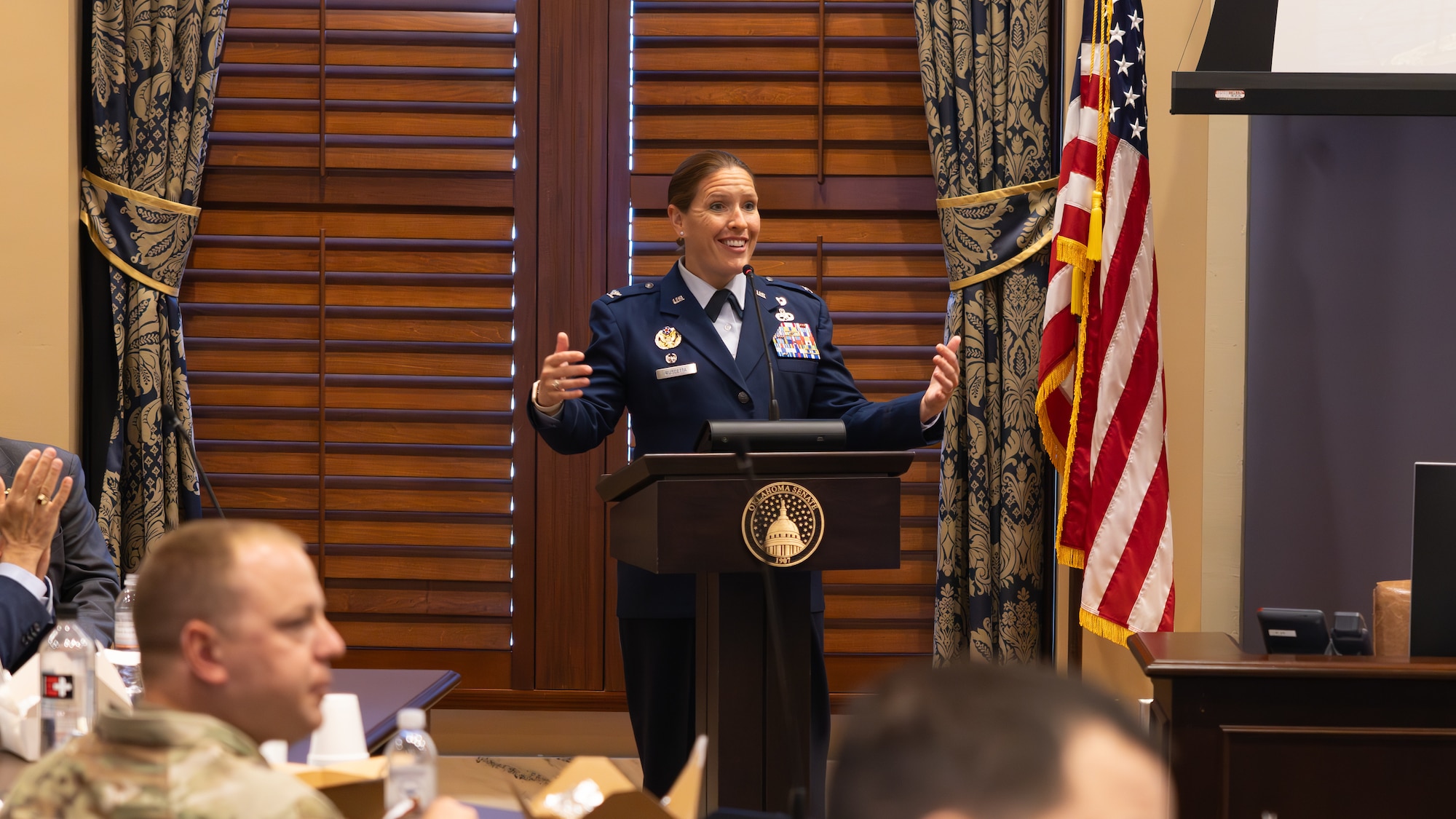 woman speaking at podium