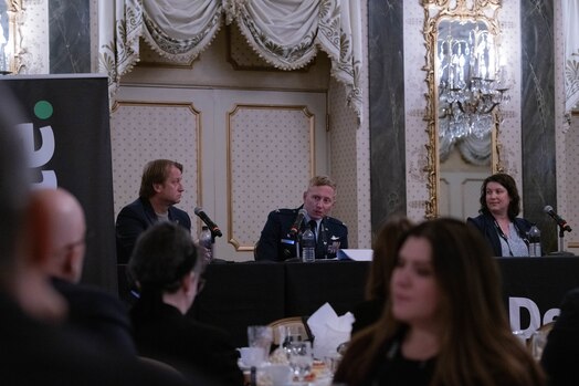  U.S. Space Force Col. Christopher A. Kennedy, Space Delta 6 - Space Access and Cyberspace Operations commander, answers an audience member's question during the Outer Space to Cyber Space luncheon panel.