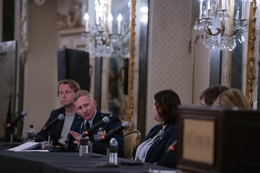  U.S. Space Force Col. Christopher A. Kennedy, Space Delta 6 - Space Access and Cyberspace Operations commander, engaging with fellow panel members.