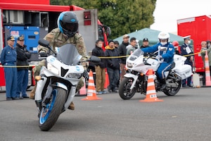 Airmen and local community members give safety demonstrations.