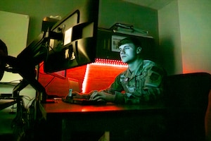 Airman Tyler Shipley, a cyber systems operations specialist with the 121st Air Refueling Wing, works on a computer at Rickenbacker Air National Guard Base, Columbus, Ohio.