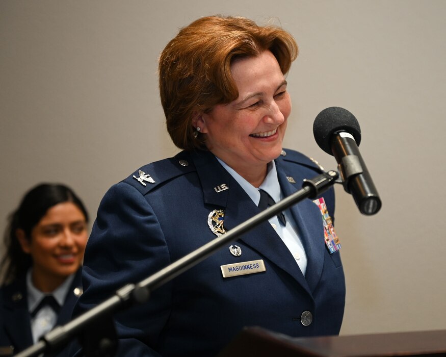 U.S. Air Force Col. Angelina Maguinness, 17th Training Wing commander, gives a speech during Col. Andres Nazario’s retirement ceremony at the Powell Event Center, Goodfellow Air Force Base, Texas, April 2, 2024. Nazario concluded his 35 years of service as a U.S. Embassy and Consulate executive in the Mexico Defense Attache Office. (U.S. Air Force photo by Airman 1st Class Evelyn D’Errico)