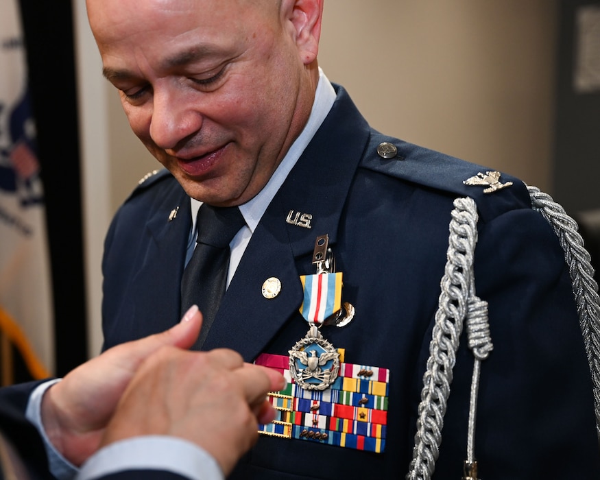 U.S. Air Force Col. Andres Nazario, United States Air Attache to Mexico, receives his retirement lapel pin from Col. Angelina Maguinness during Nazario’s retirement ceremony at the Powell Event Center, Goodfellow Air Force Base, Texas, April 2, 2024. After 35 years of service, Nazario concluded his career as a U.S. Embassy and Consulate executive in the Mexico Defense Attache Office. (U.S. Air Force photo by Airman 1st Class Evelyn D’Errico)