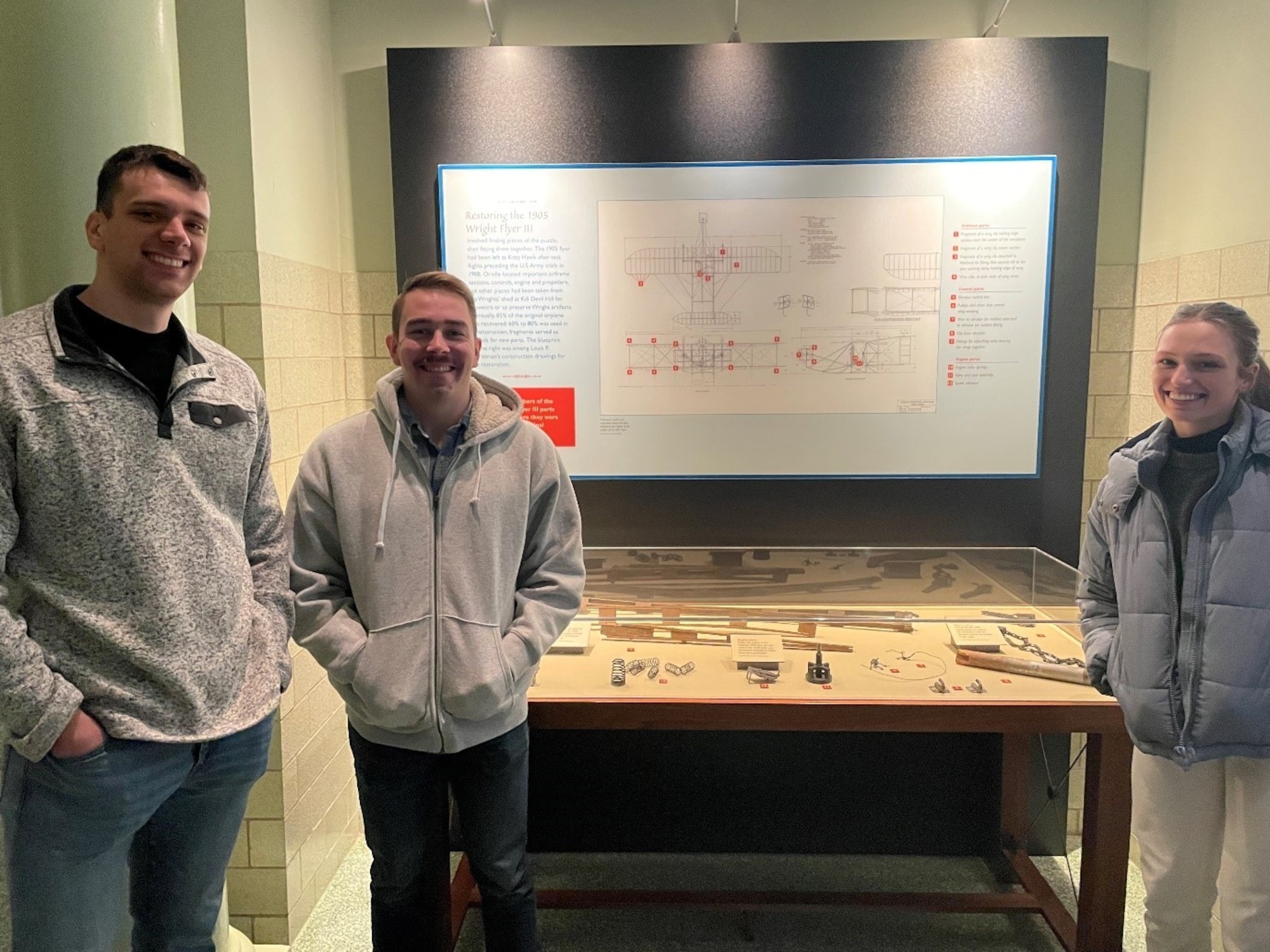 1st Lt. Ryan Winz (left), 1st Lt. Matthew Dahn, and 2d Lt. Delaney Pollak, all members of the Digital PAQuisitions team that is working to create a digital version of a light reconnaissance aircraft.