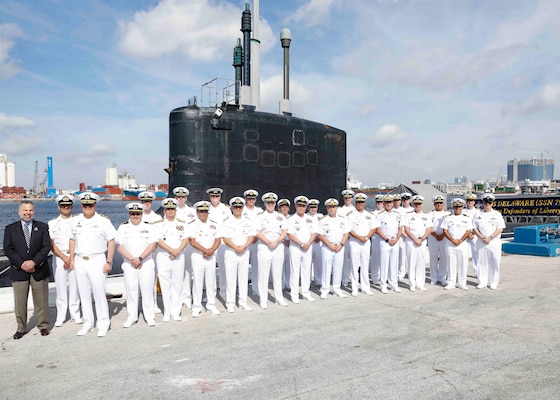 Vice Adm. Rob Gaucher, center, commander, Submarine Forces, poses with Western Hemisphere (WHEM) undersea leadership, allied and partner nation submarine force commanders in front of the Virginia-class fast-attack submarine USS Delaware (SSN 791) during the third annual Submarine Conference of the Americas (SCOTA) at Fort Lauderdale, Florida, April 3, 2024.