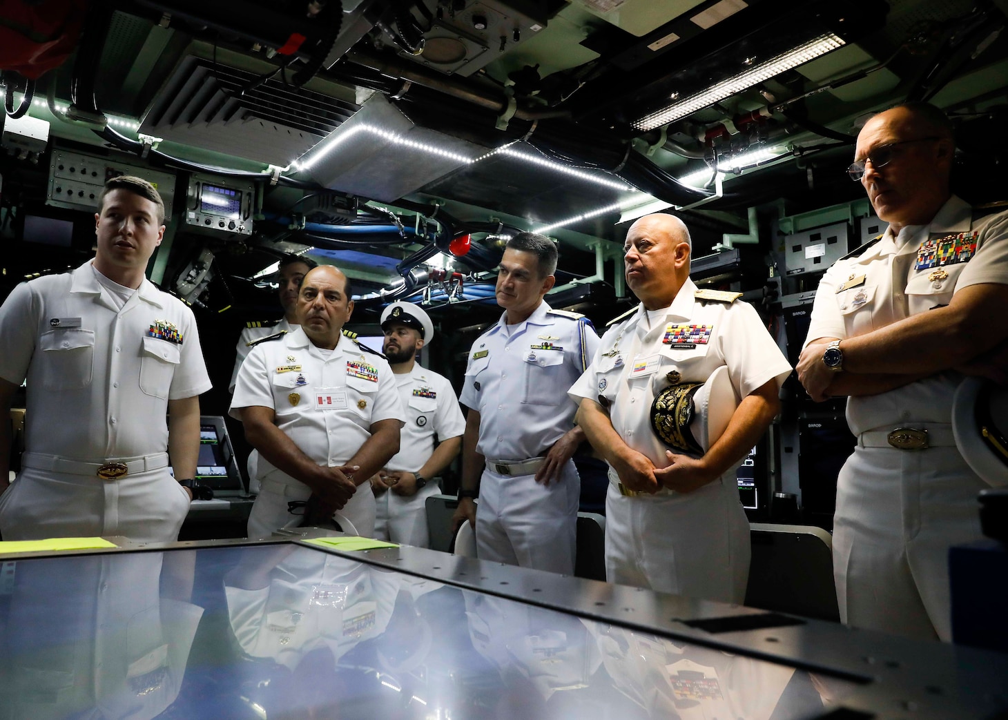 U.S., allied and partner nation submarine force commanders tour the control room aboard the Virginia-class fast-attack submarine USS Delaware (SSN 791) during the third annual Submarine Conference of the Americas (SCOTA) at Fort Lauderdale, Florida, April 3, 2024.