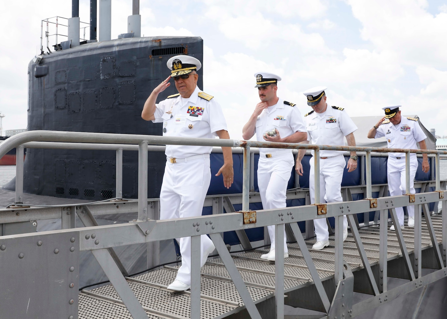 U.S., allied and partner nation submarine force commanders depart after a tour aboard the Virginia-class fast-attack submarine USS Delaware (SSN 791) during the third annual Submarine Conference of the Americas (SCOTA) at Fort Lauderdale, Florida, April 3, 2024.