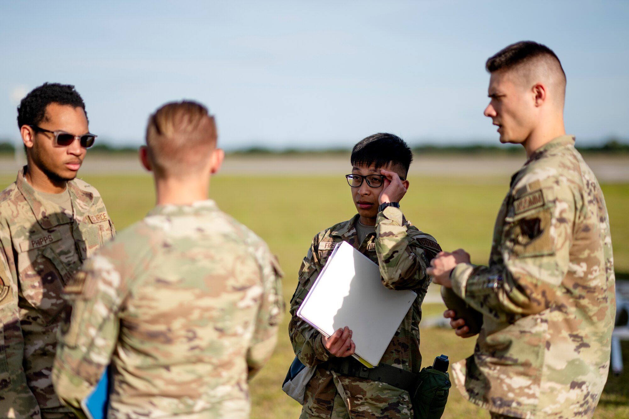 U.S. Air Force Airmen assigned to the 23rd Communications Squadron discuss tactical plans at Avon Park Air Force Range, Florida, April 8, 2024. The communications team established commercial internet and Air Force network stations to transmit information between the main operating base, forward operating sites, and contingency locations. Built upon Air Combat Command's directive to assert air power in contested environments, exercise Ready Tiger 24-1 aims to test and enhance the 23rd Wing’s proficiency in executing Lead Wing and expeditionary air base concepts through Agile Combat Employment and command and control operations. (U.S. Air Force photo by Tech. Sgt. Devin Boyer)