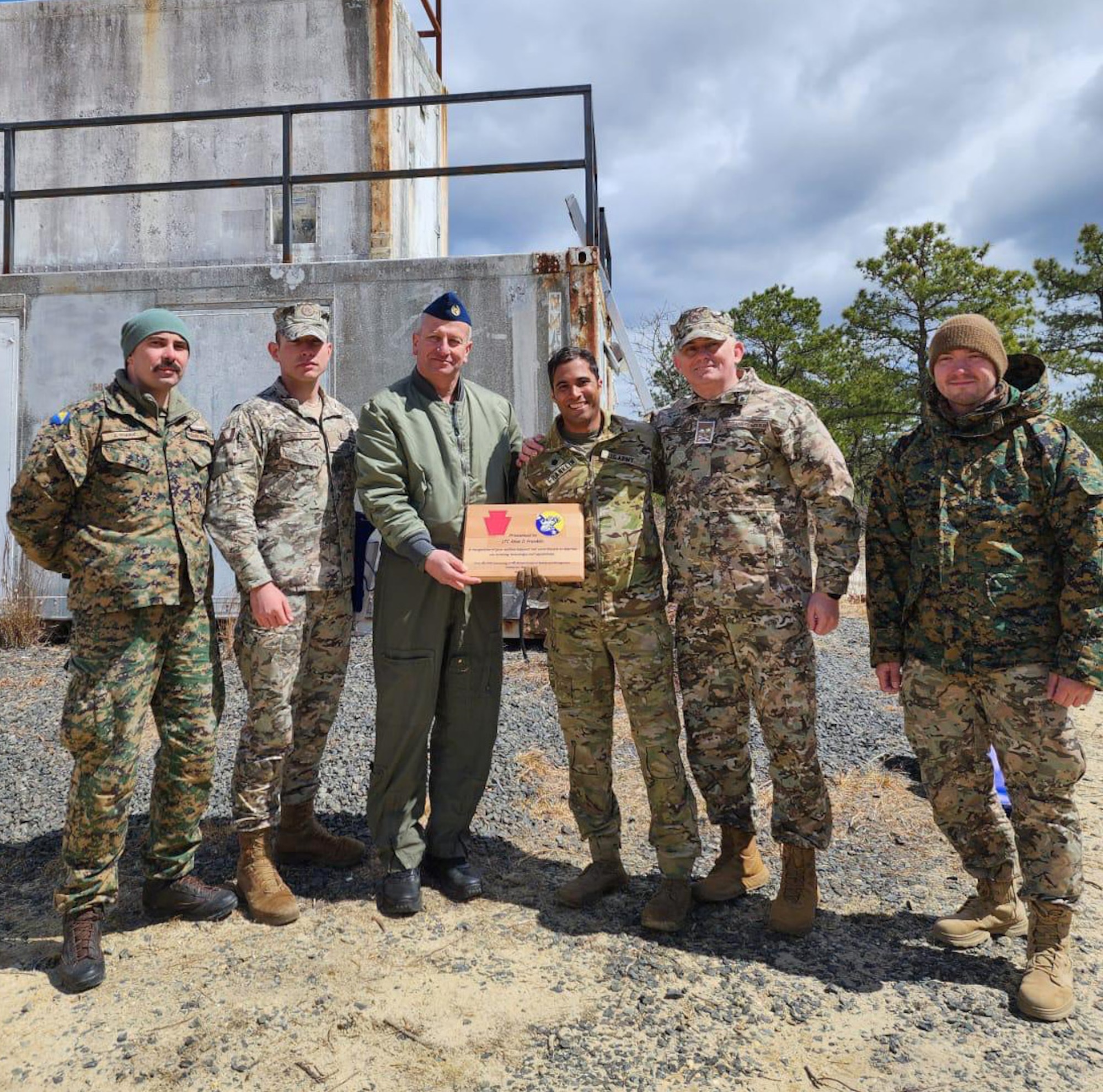 Members of the Armed Forces of Bosnia and Herzegovina and Maryland National Guard pose for a group photo during Deliberate Response '24 at Warren Grove Range, NJ, April 6, 2024.