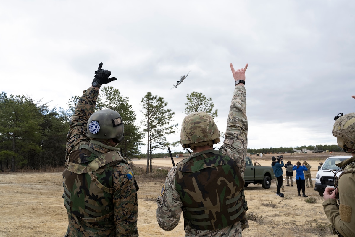 Joint Terminal Attack Controllers from the Armed Forces of Bosnia and Herzegovina gesture to an A-10C Thunderbolt II pilot during Deliberate Response '24, April 6, 2024, at Warren Grove Range, NJ.