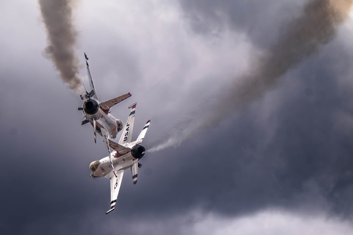 F-16 Fighting Falcons, assigned to the U.S. Air Force Demonstration team “Thunderbirds,” execute a choreographed demonstration during the Luke Days air show March 24, 2024, at Luke Air Force Base, Ariz. The pilots perform approximately 30 maneuvers in a demonstration and the entire show runs about one hour and 15 minutes. (U.S. Air Force photo by Airman 1st Class Mason Hargrove)