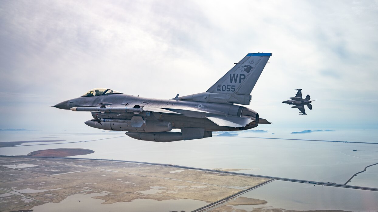 Two F-16 Fighting Falcons from the 35th Fighter Squadron, fly over South Korea’s southern coast