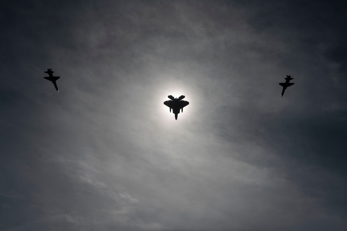 Two T-38A Talons and an F-22A Raptor conduct flying operations during the total solar eclipse in Ohio, April 8, 2024. The squadrons were conducting dissimilar formation training in unfamiliar airspace. (U.S. Air Force by Tech. Sgt. Matthew Coleman-Foster)