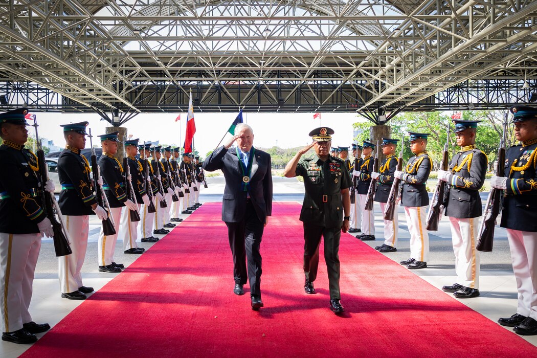 Secretary of the Air Force Frank Kendall and Armed Forces Philippines Chief of Staff Gen. Romeo Brawner walk together during a reception ceremony