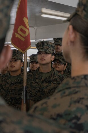 U.S. Marine Corps Recruit Gabrielle Angeles with Charlie Company, 1st Recruit Training Battalion, stands at attention prior to the series commander inspection at Marine Corps Recruit Depot San Diego, California, April 5, 2024. The series commander inspection is one of several inspections recruits will undergo throughout the duration of their training at MCRD San Diego and aims to ensure the recruits are upholding the uniform orders given to them. (U.S. Marine Corps photo by Lance Cpl. Alexandra M. Earl)