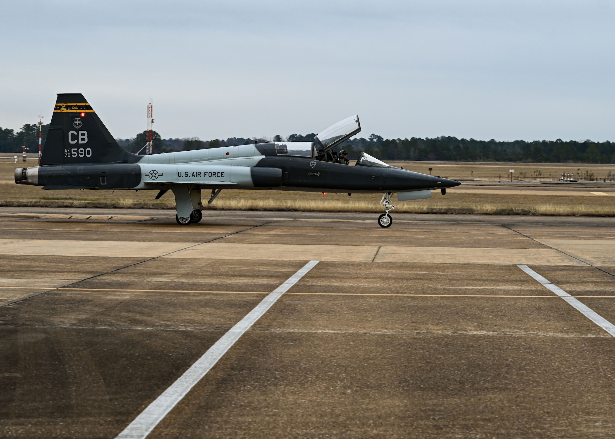 A T-38 is taxied down the Columbus Air Force Base runway.