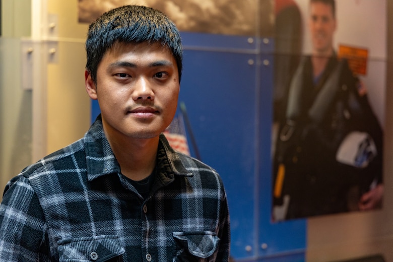 Jun Young Kim poses for a photograph at the Los Angeles Military Entrance Processing Station in El Segundo, Calif., April 1. Kim, a native of Seoul, South Korea, and graduate of Granada Hills Charter High School, is participating in the expedited naturalization program during recruit training. The Marine Corps, in collaboration with the United States Citizenship and Immigration Services, have reinstated the expedited naturalization program in order to provide qualified recruits the opportunity to become naturalized U.S. citizens upon completion of recruit training. (U.S. Marine Corps photo by Staff Sgt. Courtney G. White)