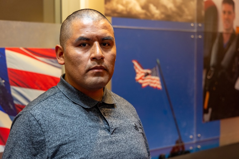 Jonas Sinhue Hernandez poses for a photograph at the Los Angeles Military Entrance Processing Station in El Segundo, Calif., April 1. Hernandez, a native of Oaxaca, Mexico, and graduate of Wallis Annenberg High School, is participating in the expedited naturalization program during recruit training. The Marine Corps, in collaboration with the United States Citizenship and Immigration Services, have reinstated the expedited naturalization program in order to provide qualified recruits the opportunity to become naturalized U.S. citizens upon completion of recruit training. (U.S. Marine Corps photo by Staff Sgt. Courtney G. White)
