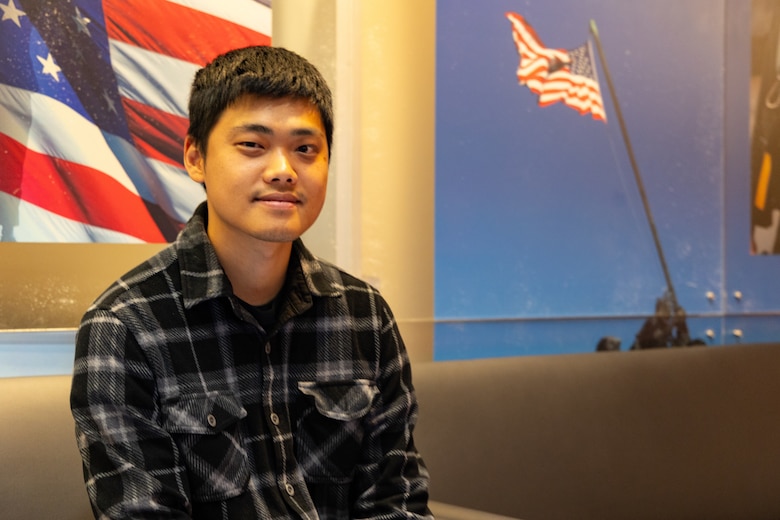 Jun Young Kim poses for a photograph at the Los Angeles Military Entrance Processing Station in El Segundo, Calif., April 1. Kim, a native of Seoul, South Korea, and graduate of Granada Hills Charter High School, is participating in the expedited naturalization program during recruit training. The Marine Corps, in collaboration with the United States Citizenship and Immigration Services, have reinstated the expedited naturalization program in order to provide qualified recruits the opportunity to become naturalized U.S. citizens upon completion of recruit training. (U.S. Marine Corps photo by Staff Sgt. Courtney G. White)