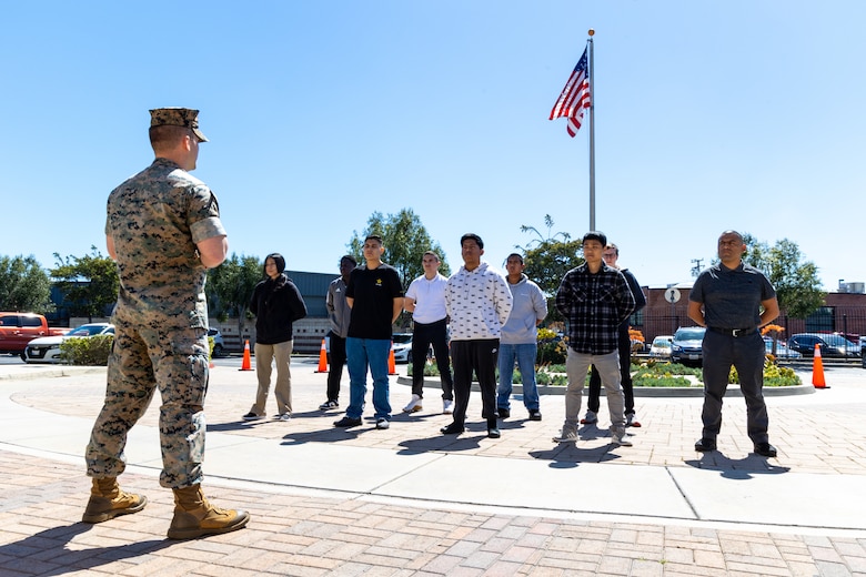 U.S. Marine Corps Capt. Timothy Bowman, the Los Angeles Military Entrance Processing Station operations officer, prepares to administer the oath of enlistment to applicants enlisting into the U.S. Armed Forces at the LA MEPS in El Segundo, Calif., April 1. The Marine Corps, in collaboration with the United States Citizenship and Immigration Services, have reinstated the expedited naturalization program in order to provide qualified recruits the opportunity to become naturalized U.S. citizens upon completion of recruit training. (U.S. Marine Corps photo by Staff Sgt. Courtney G. White)
