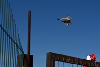 A U.S. Air Force F-22 Raptor Demonstration Team aircraft zips through the sky.