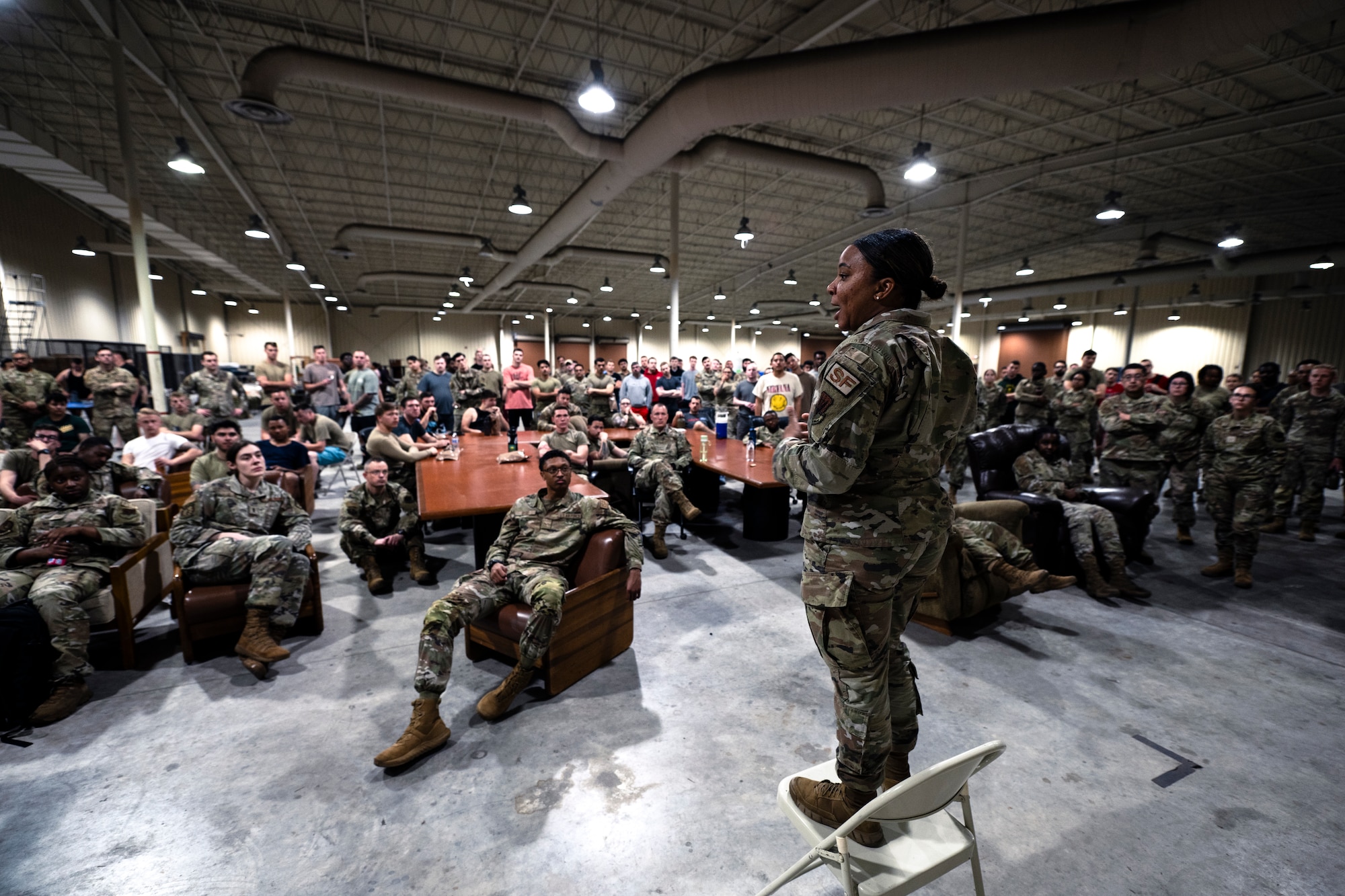 U.S. Air Force Tech. Sgt. Sashia Euley, 23rd Security Forces Alpha Flight sergeant, briefs 23rd Wing Airmen for exercise Ready Tiger 24-1 at Avon Park Air Force Range, Florida, April 9, 2024. Euley provided an overview on how the 23rd SFS will utilize Airmen from different career fields to fill base defense roles to ensure security across the forward operating site. The Ready Tiger 24-1 exercise evaluators will assess the 23rd Wing's proficiency in employing decentralized command and control to fulfill air tasking orders across geographically dispersed areas amid communication challenges. (U.S. Air Force photo by Tech. Sgt. Devin Boyer)