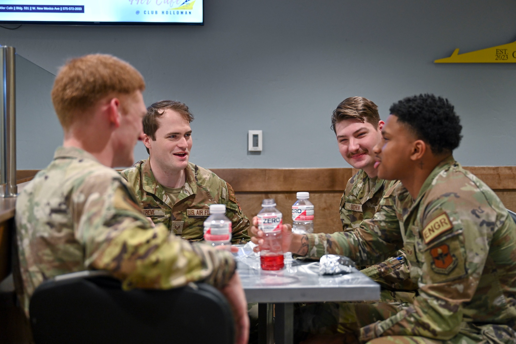 Airmen from Holloman enjoy a lunch break in the 49er Cafe at Holloman Air Force Base, New Mexico, March 27, 2024. The 49er Cafe, located at Club Holloman offers all base personnel a healthy alternative while the Shifting Sand Dining Facility undergoes renovation. (U.S. Air Force photo by Airman 1st Class Michelle Ferrari)