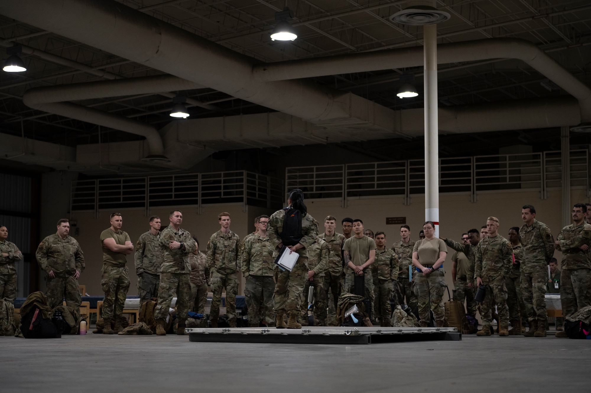 U.S. Air Force Maj. Maureen Medina, 23rd Air Base Squadron commander, gives a welcome brief to Airmen for exercise Ready Tiger 24-1 at Avon Park Air Force Range, Florida, April 8, 2024. Medina provided ground rules for the exercise at the forward operating site. Ready Tiger 24-1 is a readiness exercise demonstrating the 23rd Wing’s ability to plan, prepare and execute operations and maintenance to project air power in contested and dispersed locations, defending the United States’ interests and allies. (U.S. Air Force photo by Senior Airman Rachel Coates)