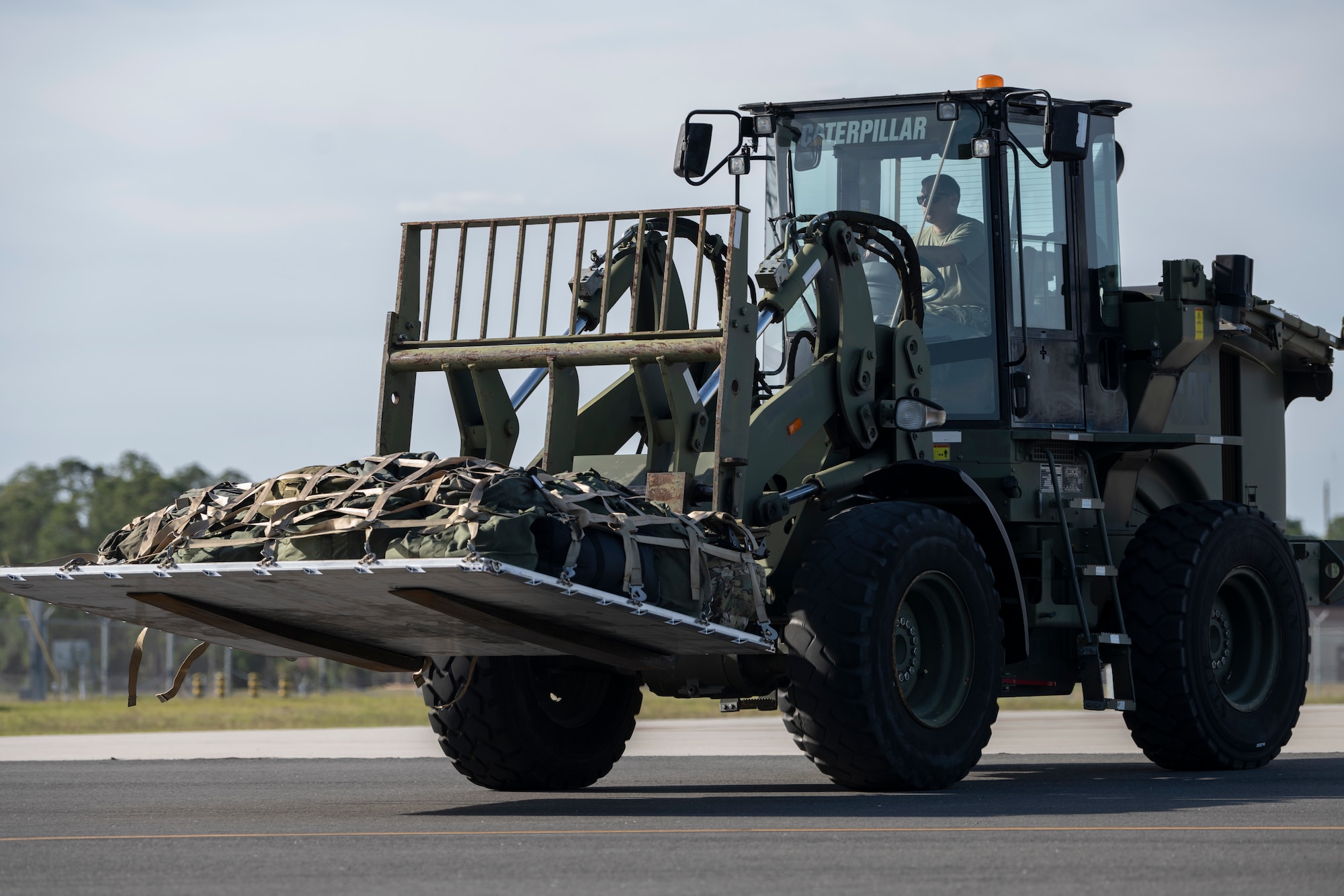 8U.S. Air Force Senior Airman Calvin Newvine, 23rd Logistics Readiness Squadron air transportation technician, transports palletized luggage at Avon Park Air Force Range, Florida, April 8, 2024. Air transportation Airmen are responsible for securing, managing and transporting personnel and cargo. Ready Tiger 24-1 is a readiness exercise demonstrating the 23rd Wing’s ability to plan, prepare and execute operations and maintenance to project air power in contested and dispersed locations, defending the United States’ interests and allies. (U.S. Air Force photo by Senior Airman Rachel Coates)