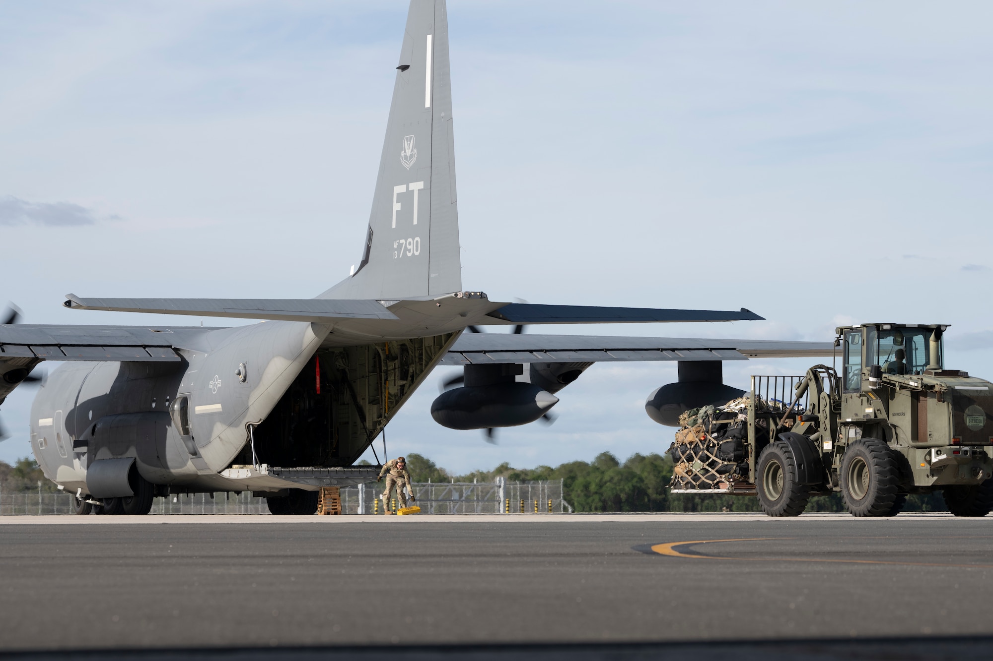 U.S. Air Force Senior Airman Calvin Newvine, 23rd Logistics Readiness Squadron air transportation technician, unloads cargo from an HC-130J Combat King II at Avon Park Air Force Range, Florida, April 8, 2024. The 71st Rescue Squadron transported cargo from Moody Air Force Base, Georgia to Avon Park in support of exercise Ready Tiger 24-1. Ready Tiger 24-1 is a readiness exercise demonstrating the 23rd Wing’s ability to plan, prepare and execute operations and maintenance to project air power in contested and dispersed locations, defending the United States’ interests and allies. (U.S. Air Force photo by Senior Airman Rachel Coates)