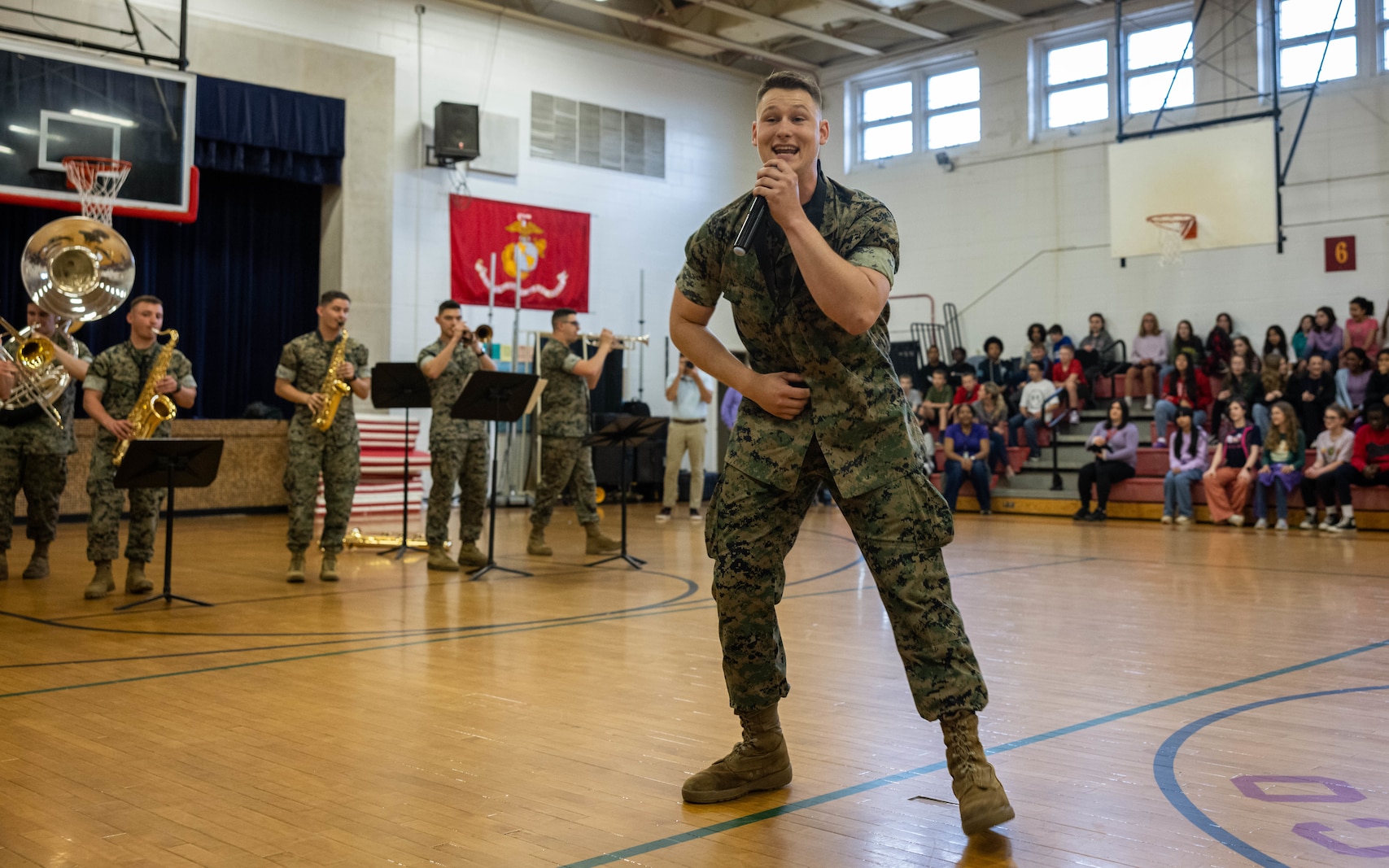 U.S. Marine Corps Lance Cpl. Kaleb Skaggs-Storm, saxophonist, an Alabama native, performs during purple up day at Quantico Middle High School, Marine Corps Base Quantico, Virginia, April 11, 2024.  Purple Up Day recognizes the children of military members during Month of the Military Child. (U.S. Marine Corps photo by Sgt. Mitchell Johnson)