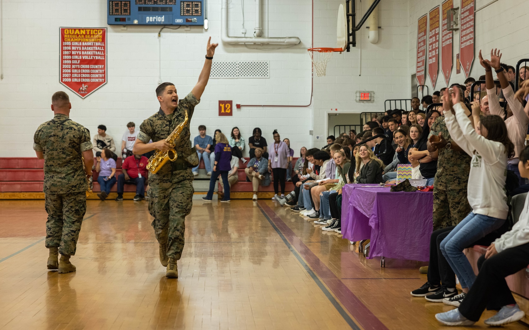 U.S. Marine Corps Miles Magnini, a saxophonist, performs during purple up day at Quantico Middle High School, Marine Corps Base Quantico, Virginia, April 11, 2024.  Purple Up Day recognizes the children of military members during Month of the Military Child. (U.S. Marine Corps photo by Sgt. Mitchell Johnson)