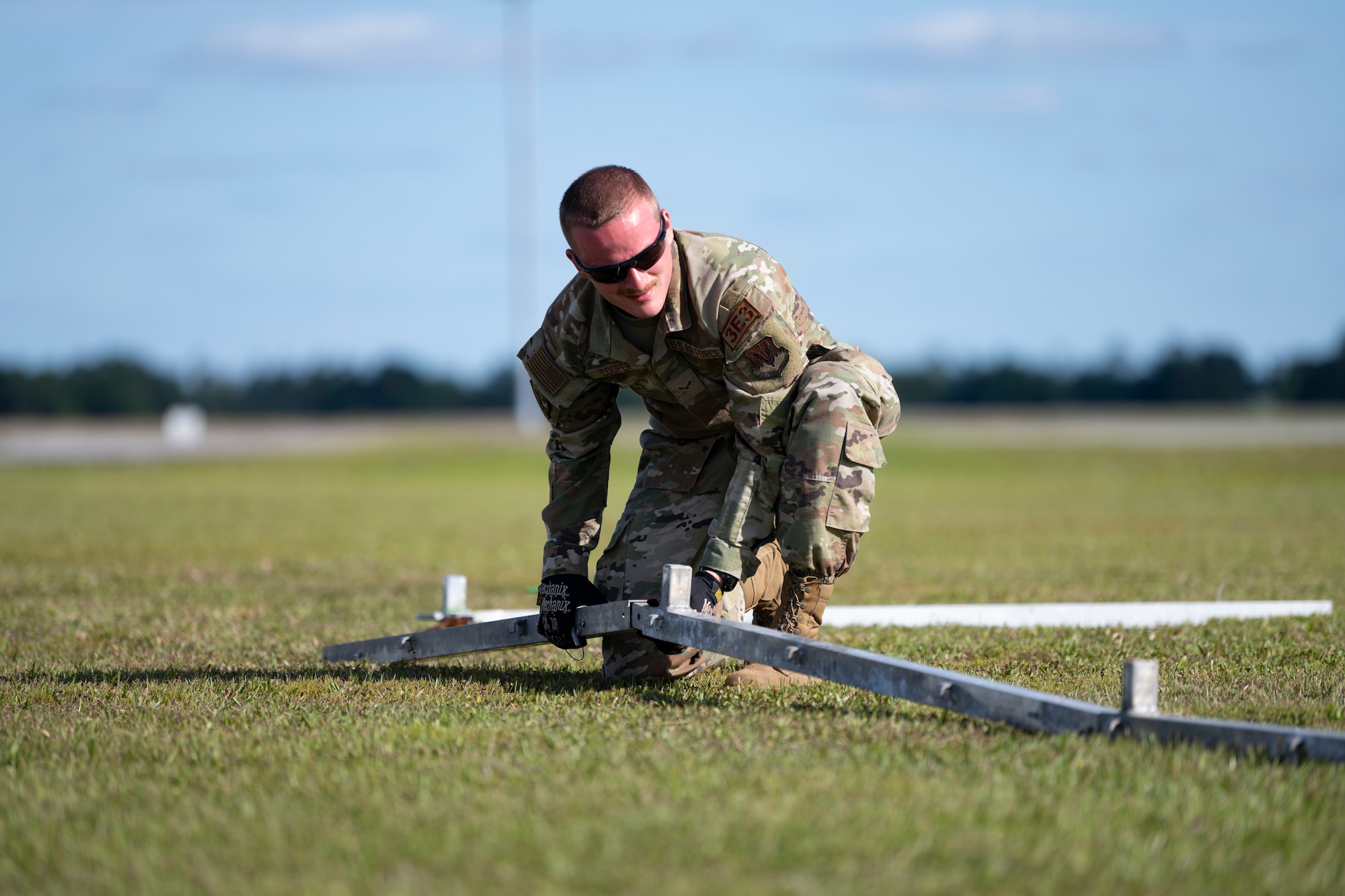 U.S. Air Force Airman 1st Class Nathaniel Cooper, 23rd Civil Engineer Squadron structural apprentice, assembles a shelter for exercise Ready Tiger 24-1 at Avon Park Air Force Range, Florida, April 8, 2024. The 23rd CES built shelters for communications, food provisions, and maintenance operations. Built upon Air Combat Command's directive to assert air power in contested environments, Exercise Ready Tiger 24-1 aims to test and enhance the 23rd Wing’s proficiency in executing Lead Wing and Expeditionary Air Base concepts through Agile Combat Employment and command and control operations. (U.S. Air Force photo by Senior Airman Rachel Coates)