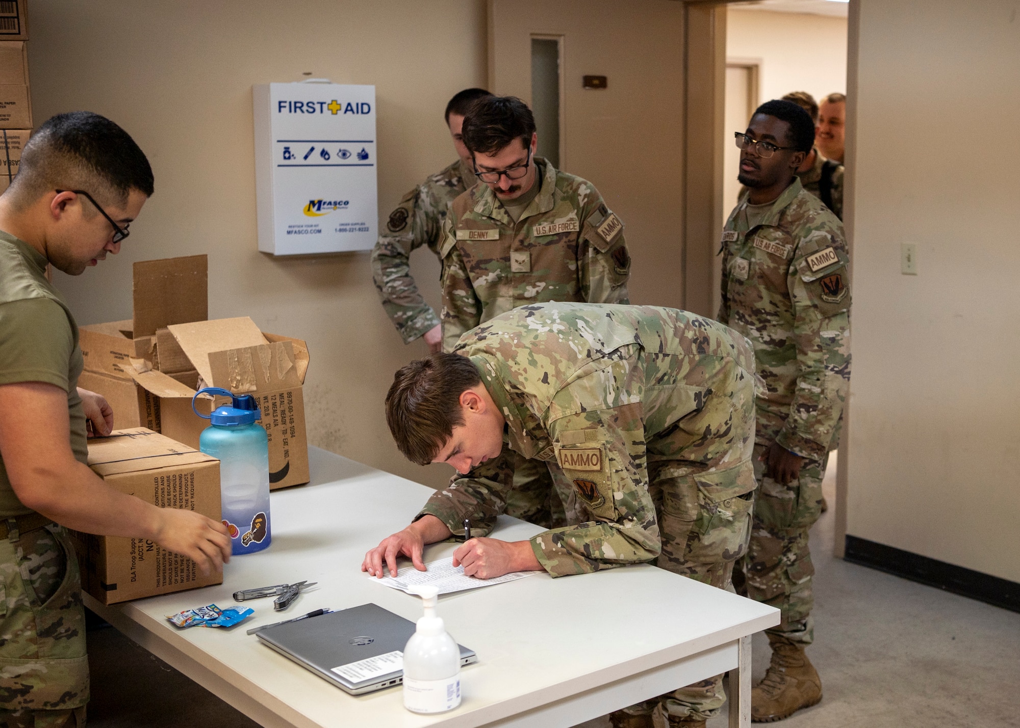 U.S. Air Force Airmen assigned to the 23rd Munitions Squadron in-process at Avon Park Air Force Range, Florida, April 9, 2024. Services Airmen issued provisions to all Airmen until the forward operating site could establish a single pallet expeditionary kitchen. (U.S. Air Force photo by Airman 1st Class Leonid Soubbotine)