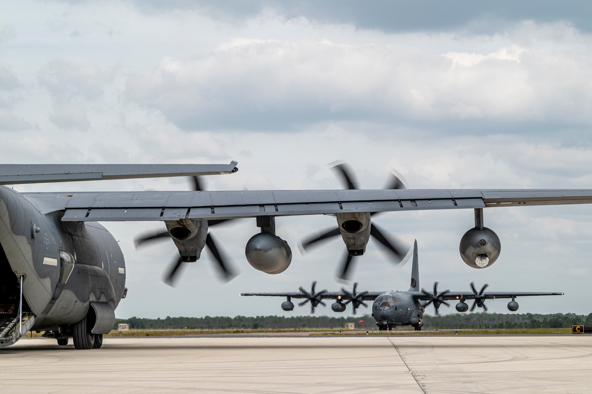 U.S. Air Force Airmen from Moody Air Force Base, Georgia, arrive at Avon Park Air Force Range, Florida, aboard HC-130J Combat King II aircraft, April 9, 2024. The Airmen rapidly deployed to forward operating sites and contingency locations for exercise Ready Tiger 24-1 where they practiced Agile Combat Employment concepts. (U.S. Air Force photo by Airman 1st Class Leonid Soubbotine)